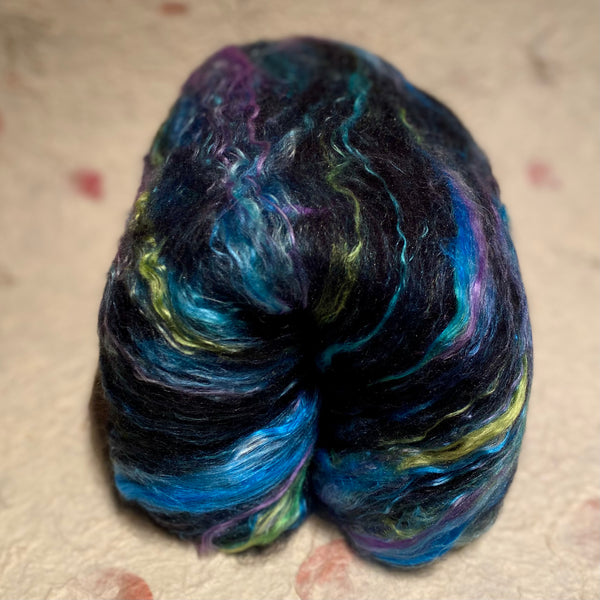 IxCHeL Fibre And Yarns Gothic Bunny Batt Demon Hunter colour way with blues and greens and purple coloured mulberry silk and black merino and angora bunny