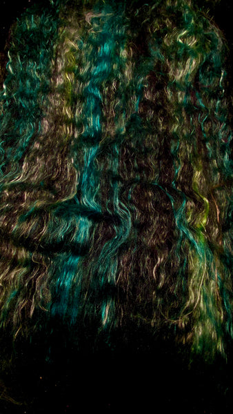 IxCHeL Fibre And Yarns Gothic Bunny Batts laid out flat in Monsters colourway in teals greens and black merinoand angora bunny