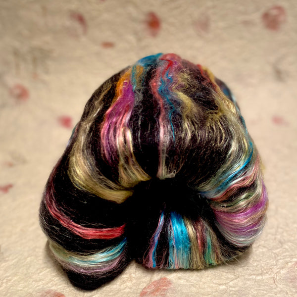 IxCHeL Fibre And Yarns Gothic Bunny Batt Unicorn colour way with rainbow coloured mulberry silk and black merino and angora bunny