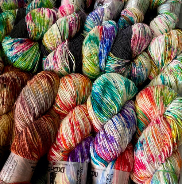 Overiew of various hand dyed sock yarns in variegated and speckled colourways by IxCHeL yarns and fibres