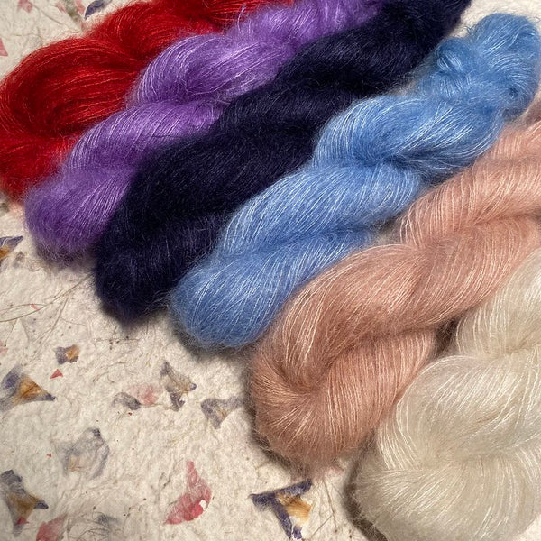 IxCHeL Fibre And Yarns Kid Mohair Silk Merino Yarn showing various colourways Poster